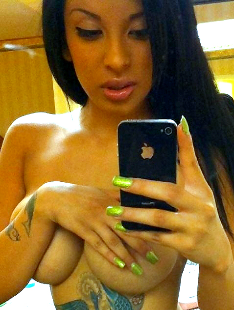 Big-tittied black babe takes different selfshots
